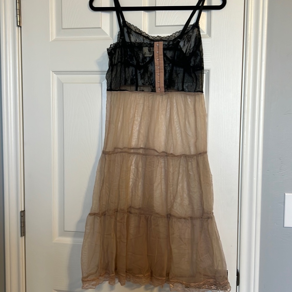 Sheer beige and black lace dress